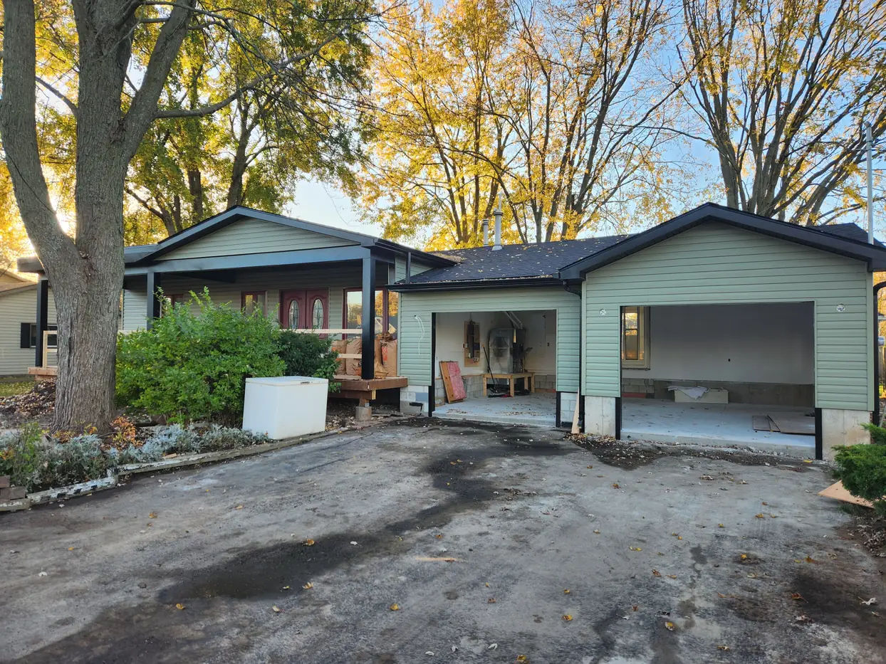 Sage siding with black gutters & soffit — Custom Seamless Eavestrough, Niagara