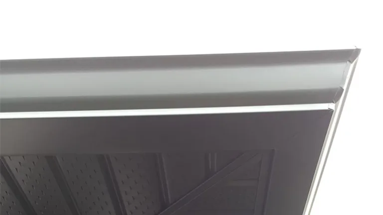 Black aluminum soffit and gutter at a roofline corner