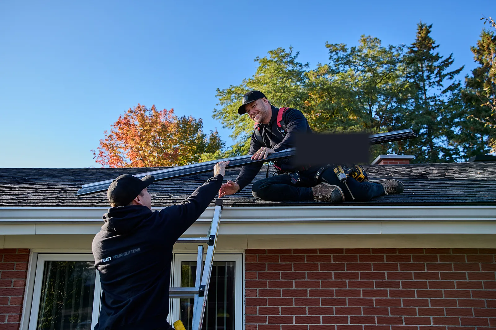 Crew installing a long gutter section — Lone Star Gutter Pros, Tarrant County TX