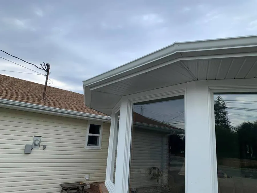 Seamless gutters and soffit around a bay window — Mid Island Gutters, Parksville BC
