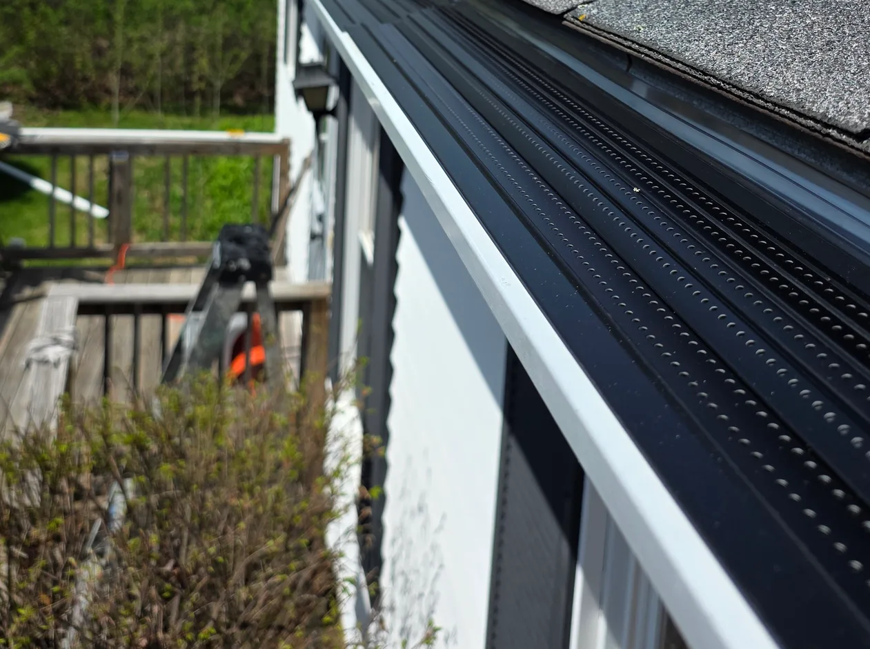 Alu-Rex continuous hanger gutter guard installed by Nature Guard Gutters