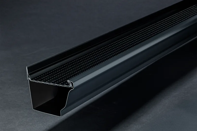 Close-up of an Alu-Rex perforated gutter guard being installed