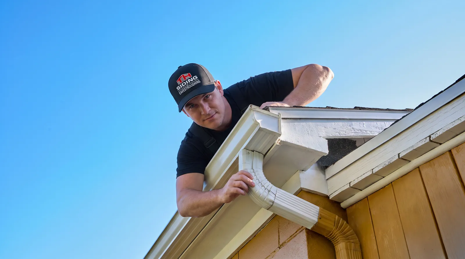 Downspout fitting and adjustment — TH Siding & Eavestrough, Sarnia ON